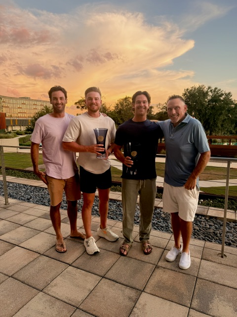 Trophy presentation on the terrace at sunset